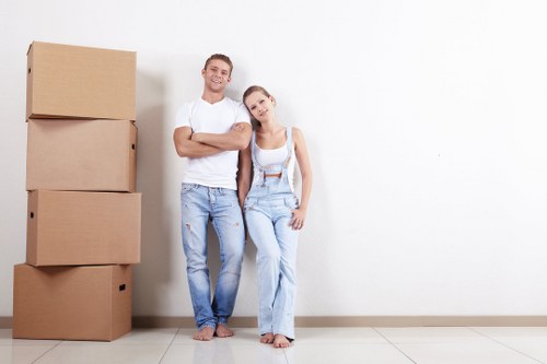 Moving home service in Kentish Town with boxes and furniture in a residential street