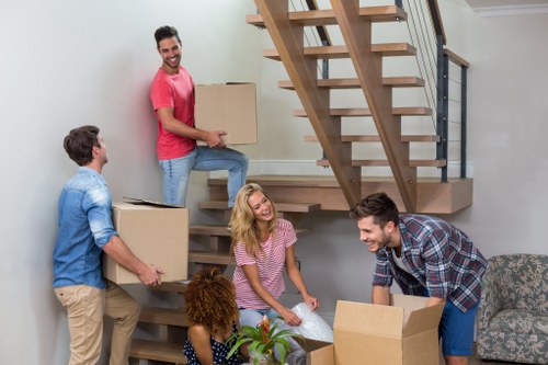 Business relocation team handling desks and equipment for an office move