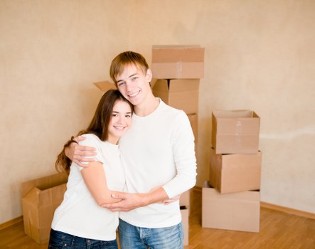 Professional movers navigating stairs in a Kentish Town apartment block