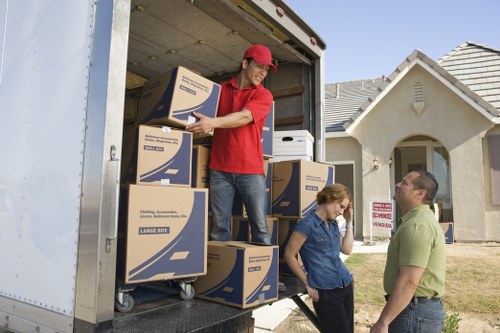 Local moving team packing fragile items in Kentish Town
